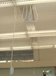 Photo of electrical cables placed overhead.